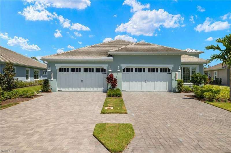 View of front facade featuring a garage