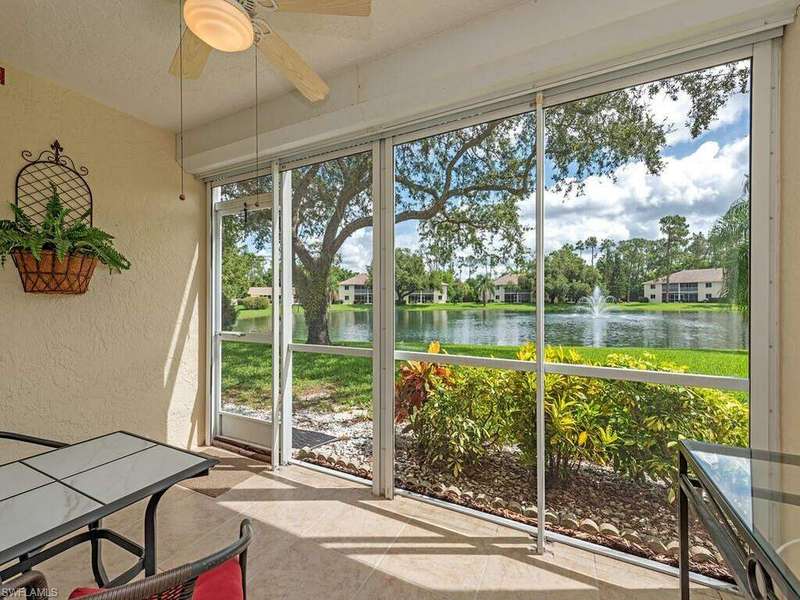 Lanai with plenty of natural light, ceiling fan, and lake view