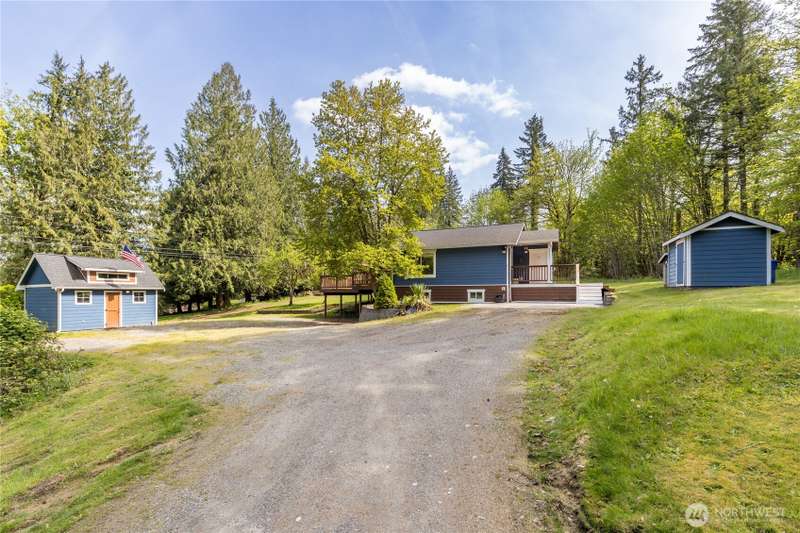 Welcome to this secluded property on a shy acre!