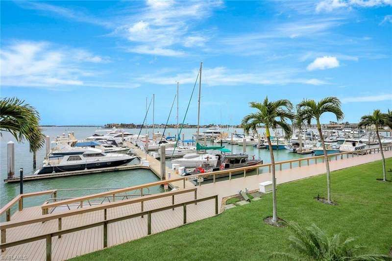 View of dock featuring a water view and a yard