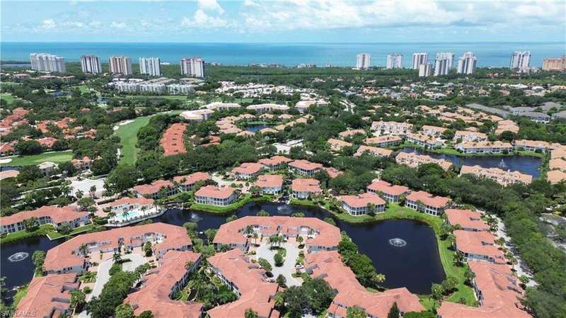 Aerial overview of property's location with a large body of water and nearby urban area