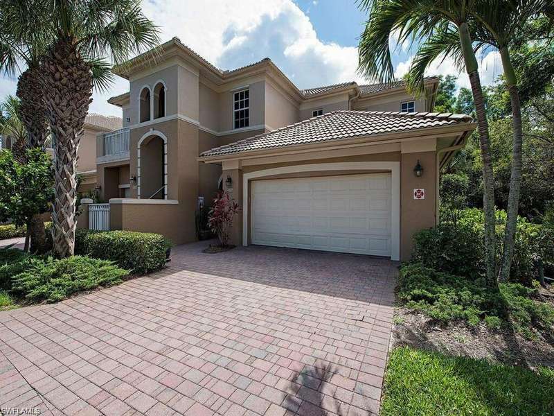 Mediterranean / spanish home with a garage