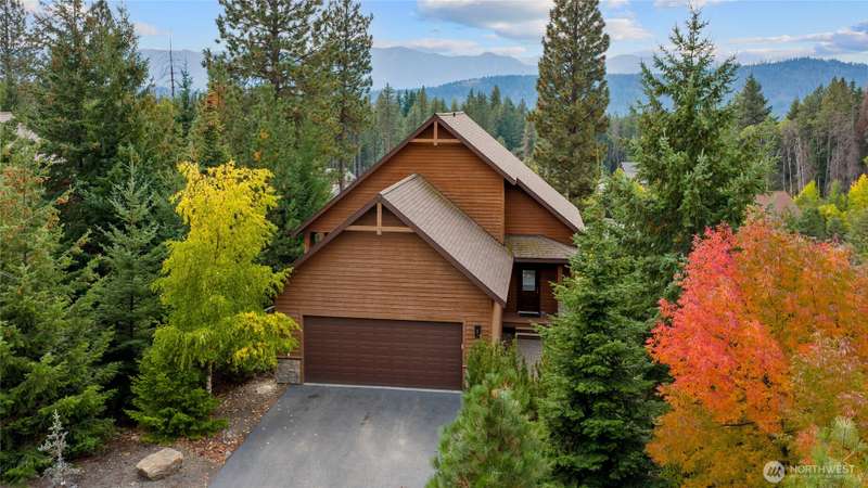 Surrounded by vibrant fall colors, this beautiful Roslyn Ridge home warmly welcomes you.