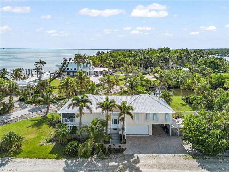 Aerial view of the home with Charlotte Harbor across the street.
