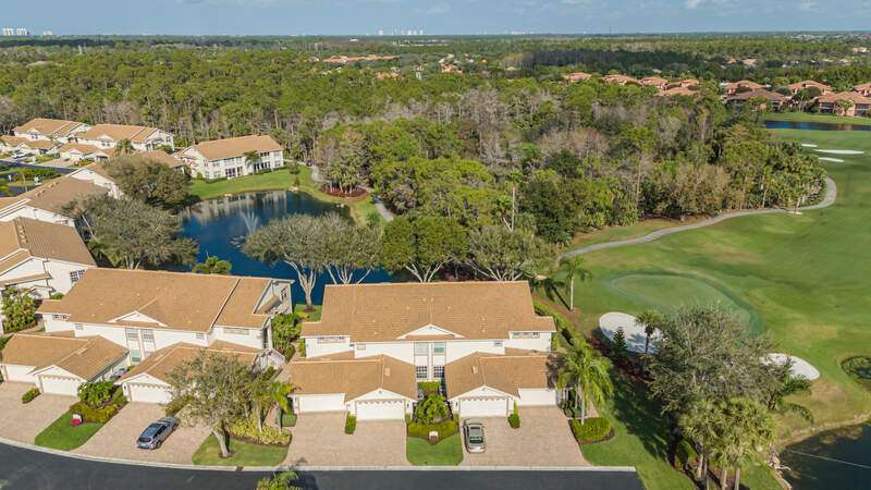 Aerial overview of property's location with a pool area and a nearby body of water