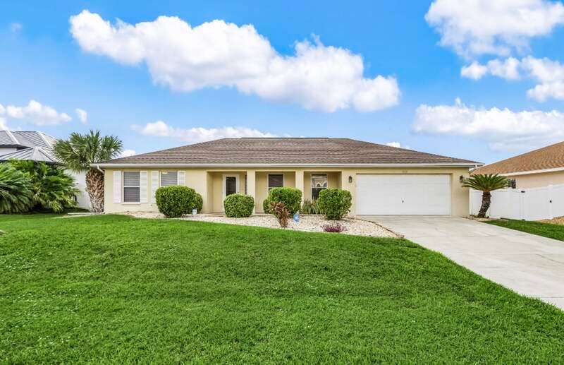 Single story home featuring stucco siding, driveway, and an attached garage
