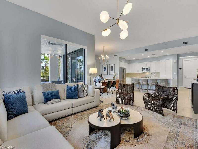 Living room with recessed lighting, visible vents, a chandelier, and light tile patterned flooring