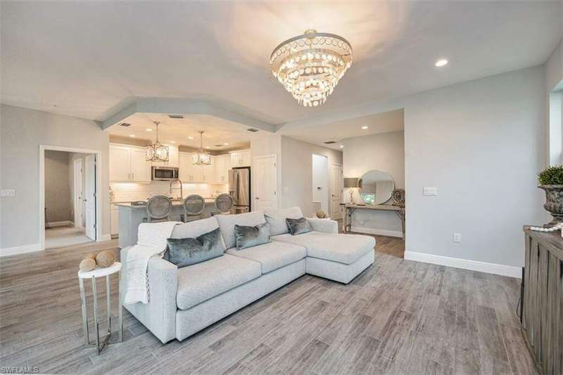 Great Room-The Chandeliers accentuate the great room in this beautiful condo