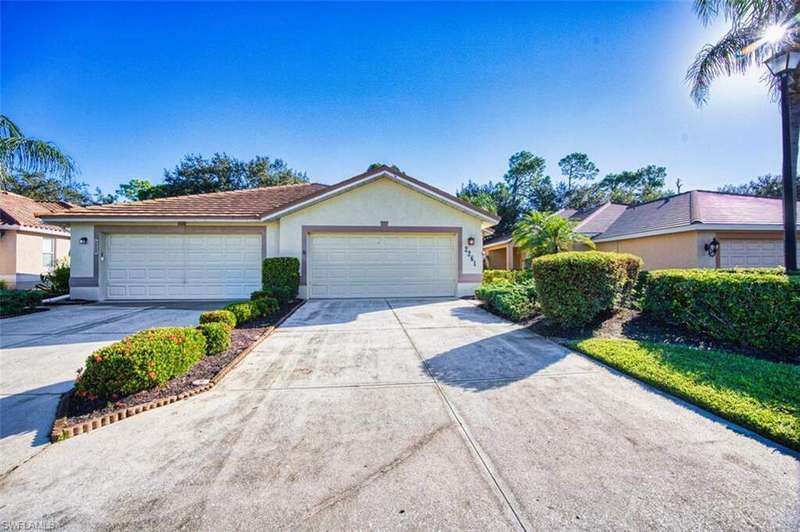 Ranch-style house with stucco siding, concrete driveway, and an attached garage