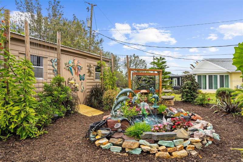 Back yard with fountain & shed