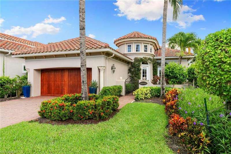 Mediterranean / spanish house featuring stucco siding, a garage, a gate, decorative driveway, and a tiled roof