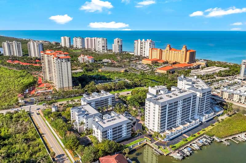 View of urban area with a nearby body of water and apartment complex