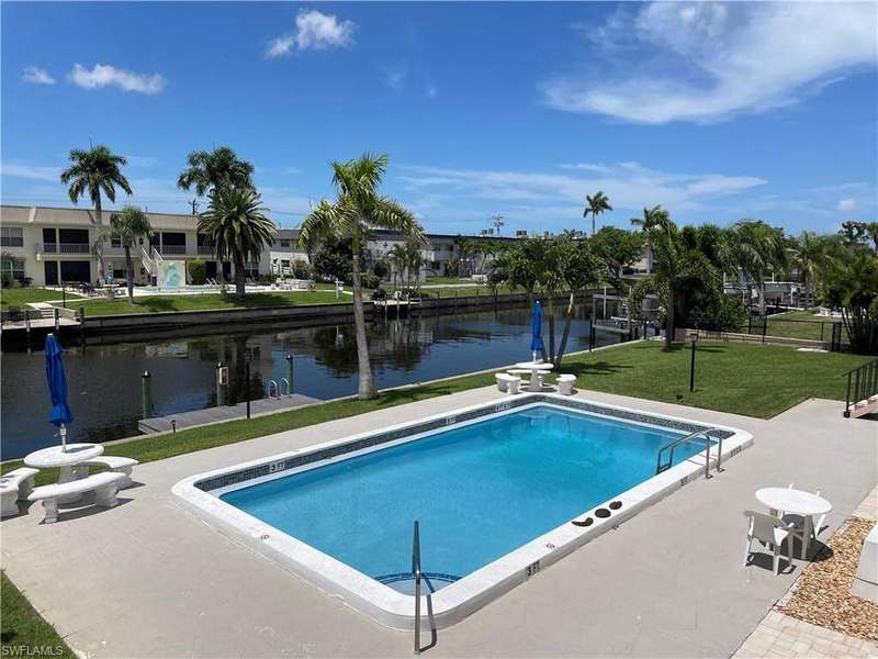 View down the Gulf Acccess SE Cape Coral wide canal with tons of fish and wildlife