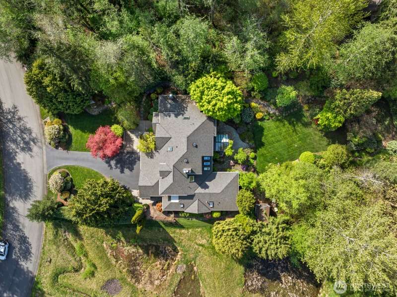 The sought after community of Lake of the Woods presents this one of a kind 4730* sq ft East facing home with an attached In-Law apartment. Located in a quiet cul-de-sac on a shy acre, the main house features soaring ceilings, 3 bedrooms, 2.5 bathrooms, m