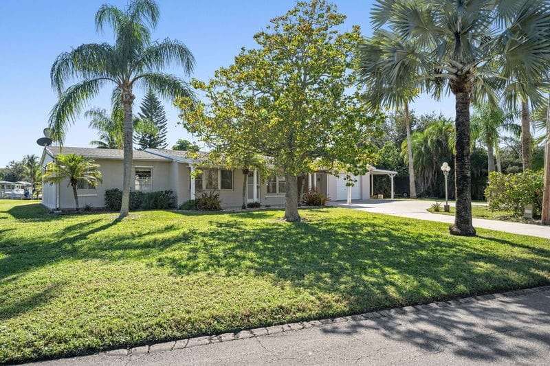 View of front facade featuring concrete driveway,