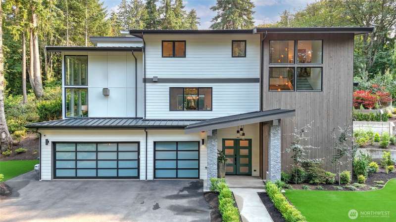 Discover the perfect blend of modern elegance and Northwest serenity in this custom-built architectural gem by Seascape Homes, ideally located just minutes from downtown Mercer Island.