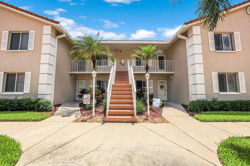 Screened in lanai with manual hurricane shutters, ceiling fan, & a golf course view
