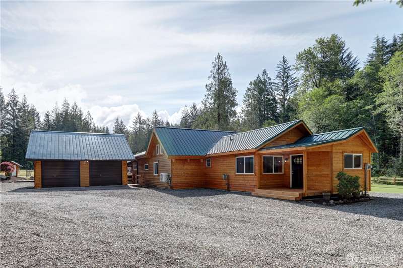 Beautifully remodeled home with 3 potential bedrooms, newer metal roof, new siding, 10 acres.