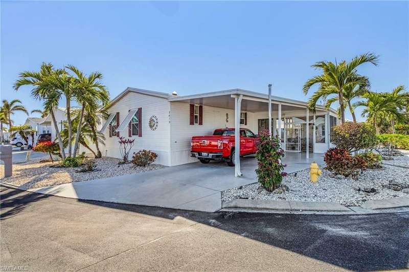 View of front of property with a carport