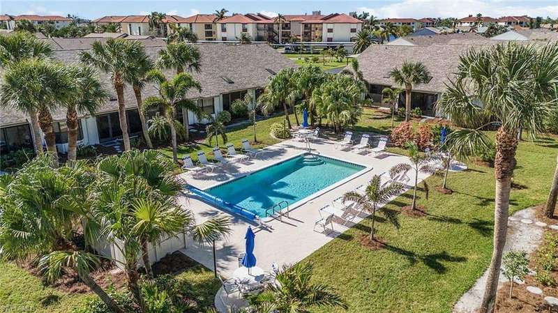 View of swimming pool For this Quad,  lawn and patio