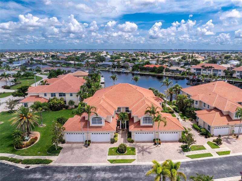 2630 Tarpon Cove, #211, is on the left side interior, with walk-way in between