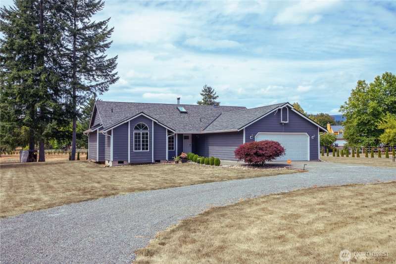 Front of home with circular driveway