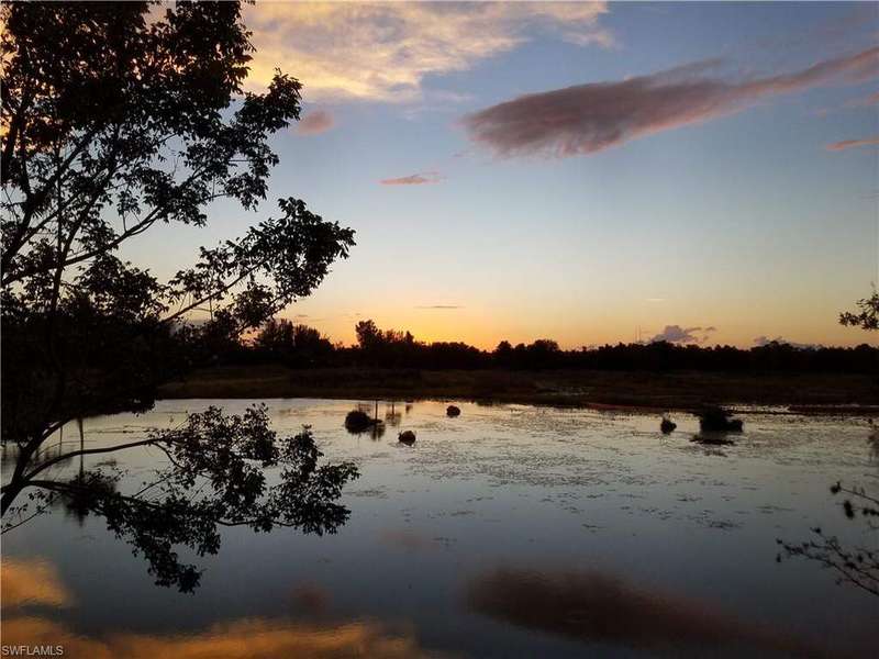 Beautiful Sunsets! View from patio to the west over the lake towards lakes park