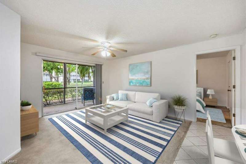Screened in Lanai with a wealth of natural light and ceiling fan