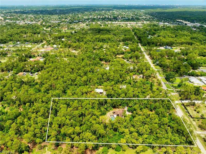 Aerial view of property's location featuring property parcel outlined