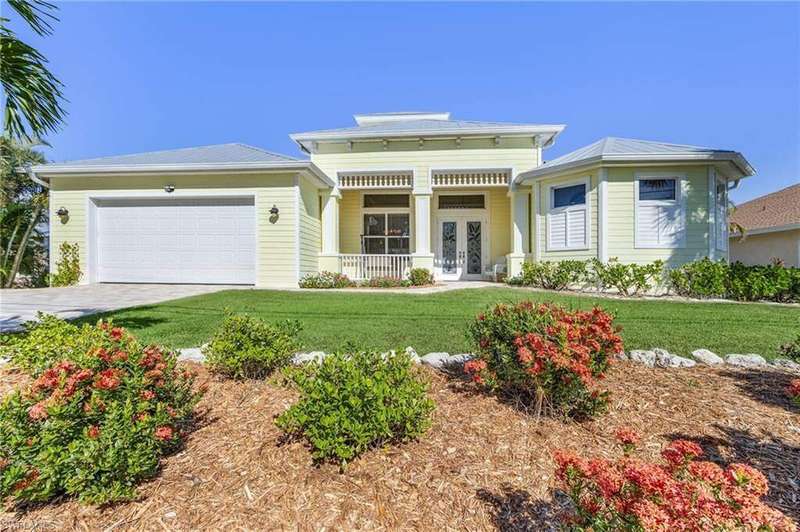 View of front of home with a porch, French doors