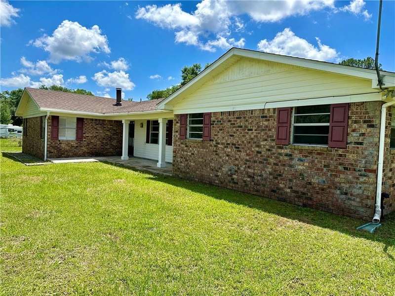 View of front of home with a yard