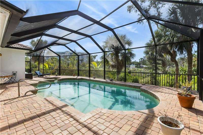 Private setting to relax and unwind! Pavered lanai w/Pool and spa and seating areas.