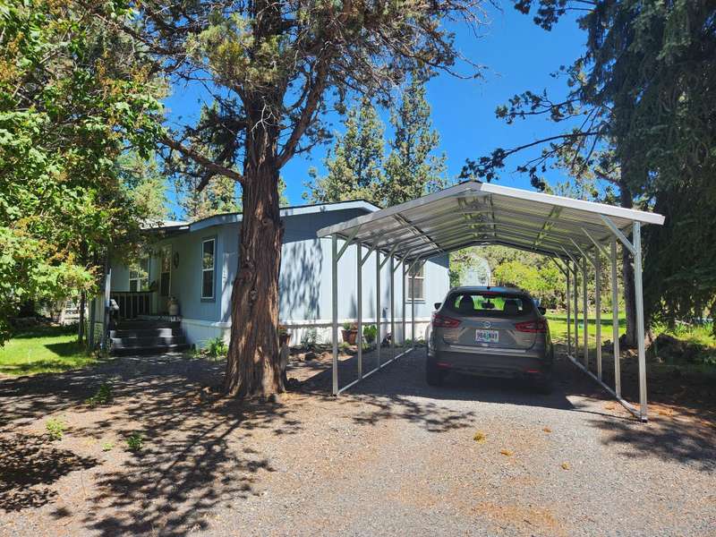1152 sq ft. 3 bedrooms and 2 baths, large corner lot, Carport and Large 10x20 Storage w/2 lofts.