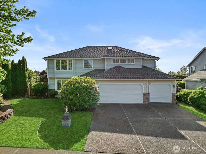 Charming two story home with 3 car garage and great curb appeal.