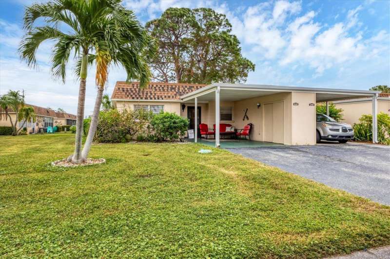 Front of villa with attached carport