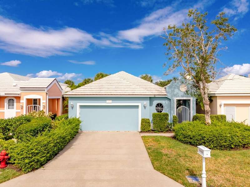 View of front of house featuring stucco siding, a