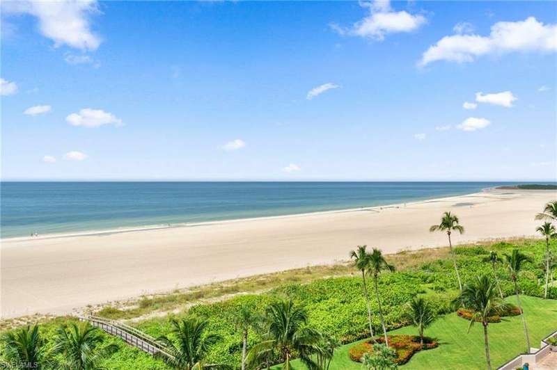 Property view of water featuring a beach view