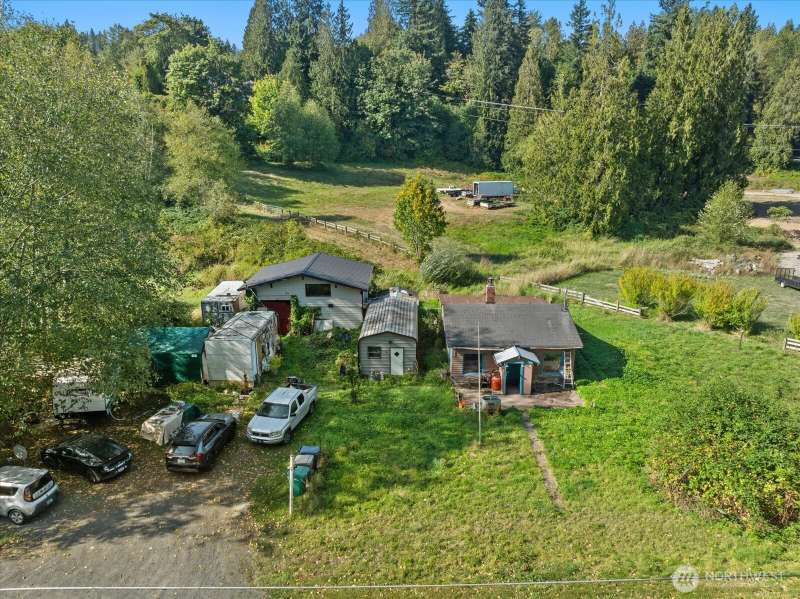 Fixer opportunity in the heart of Machias! Main home + Outbuilding & Shop