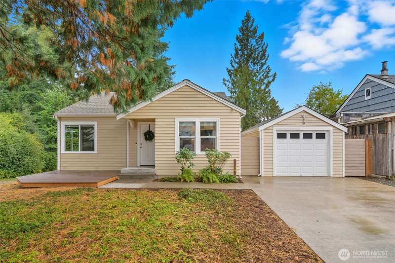 Beautifully maintained exterior with detached garage, and inviting curb appeal