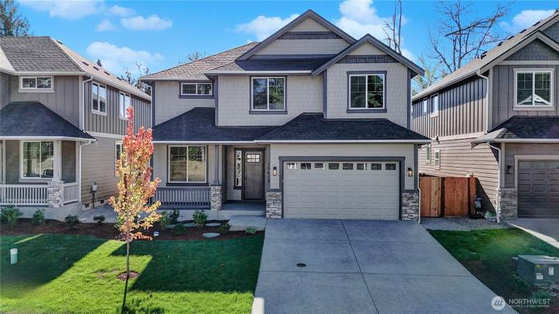 Beautifully designed new home from local, experienced northwest builder BI Homes, Inc. includes durable Hardi brand siding and accents, stone garage and post accents, an inviting front porch with energy efficient fiberglass entry door and vinyl clad windo