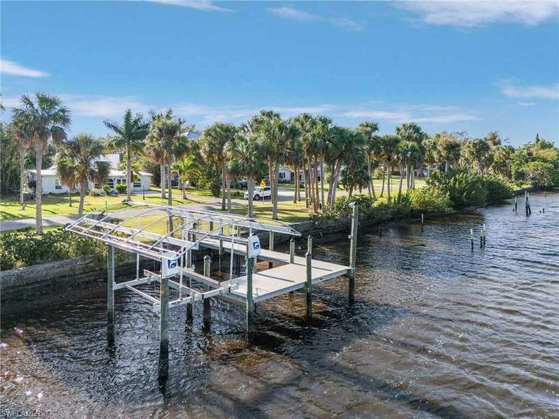 View of dock featuring a water view and boat lift