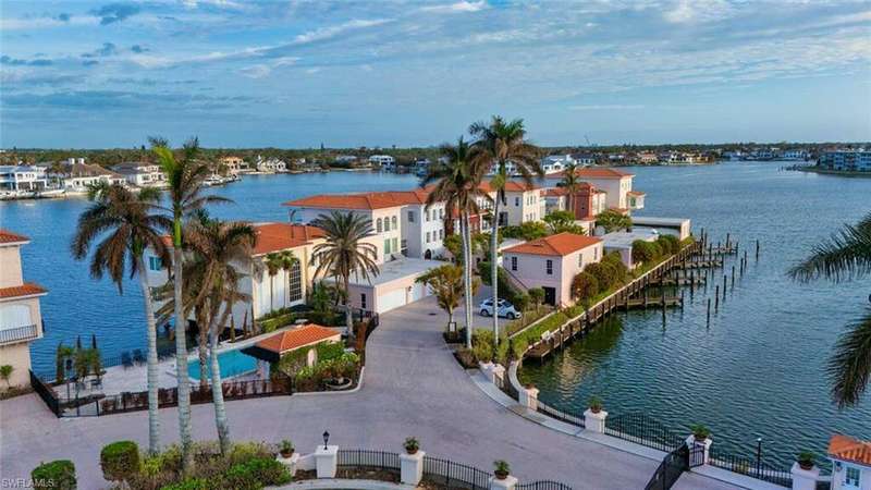 Property view of water featuring a boat dock