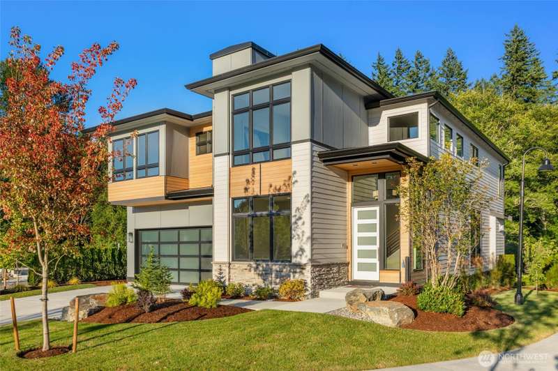 Custom Never before built design features extensive use of clear cedar siding and stone veneer accents