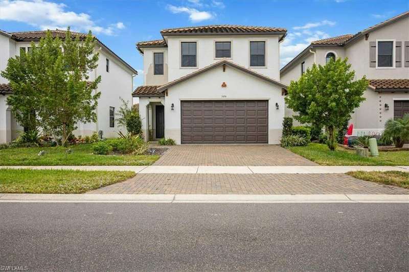 Mediterranean / spanish house featuring a garage