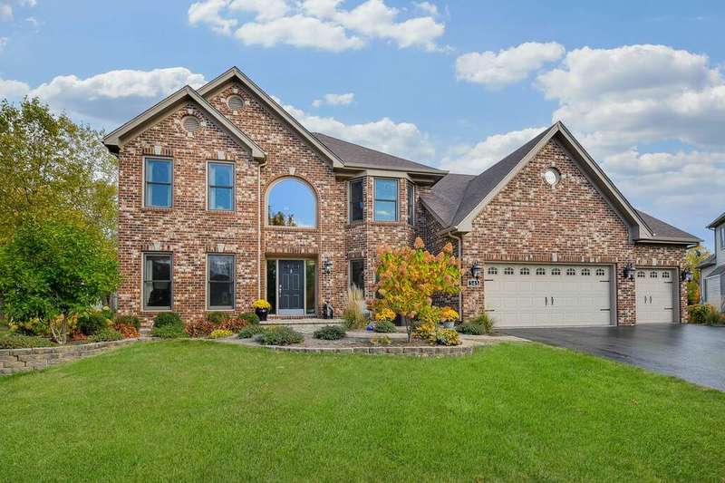 Gorgeous full brick exterior with a 3-car garage.