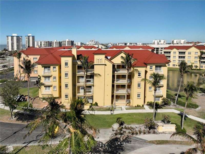 View of property with a water view