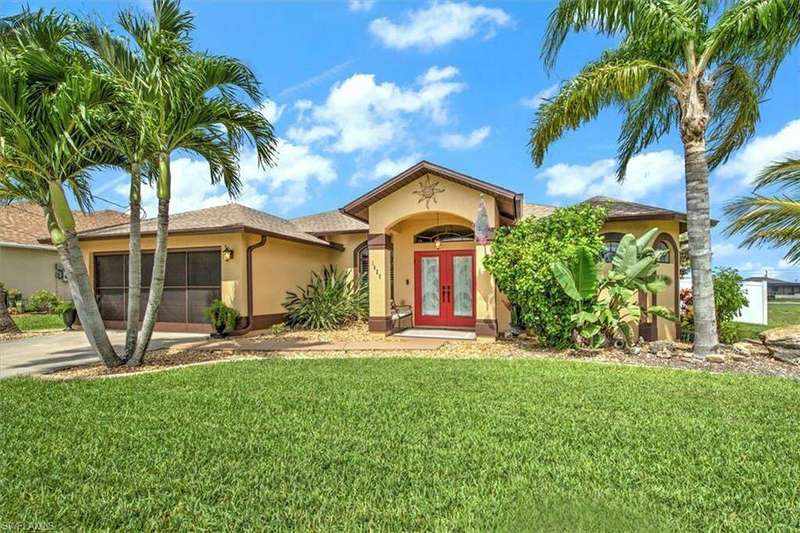 Mediterranean / spanish-style home featuring a front yard and french doors