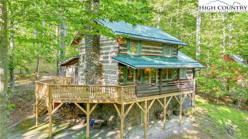 Tucked beneath a leafy canopy, this cabin is cradl