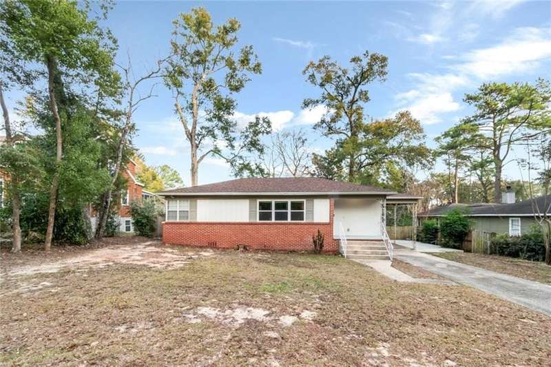 Single story home featuring a carport