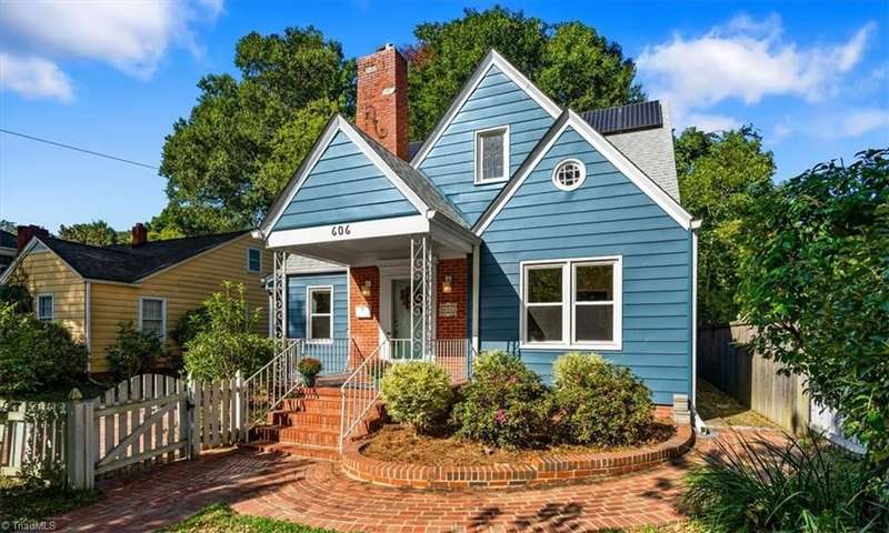 Great rocking chair front porch and beautiful brick paver walkway!